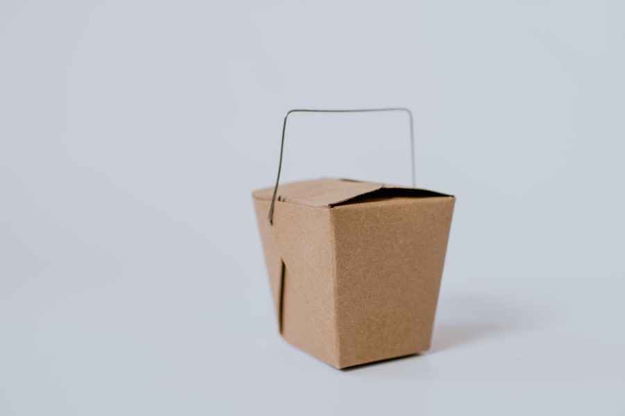 Printed kraft amenity box with a carry handle