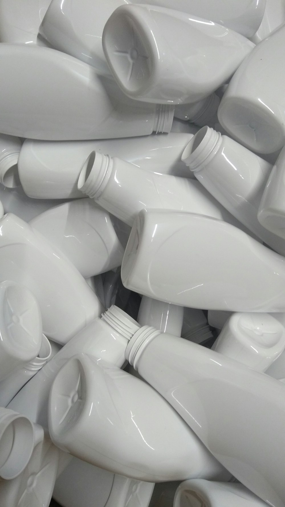 A row of matching hotel toiletry bottles