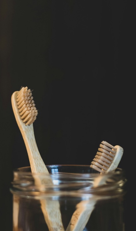Slotted bamboo soap dish on a neutral background