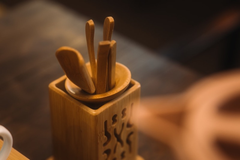 Compartmented bamboo tea tray on a neutral background