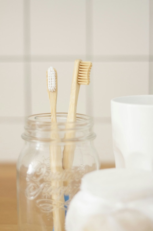 Adult bamboo toothbrush on a neutral background